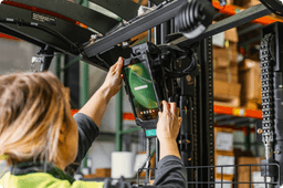Forklifts equipped with RAM® Mounts rugged mounting systems holding tablets, handheld devices, and scanners, showing durable installations built for vibration-heavy industrial use.