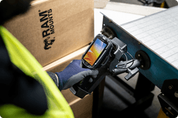 Selection of RAM® Mounts barcode scanner solutions, including adjustable holders and quick-release cradles mounted on industrial equipment for secure and accessible scanner storage.